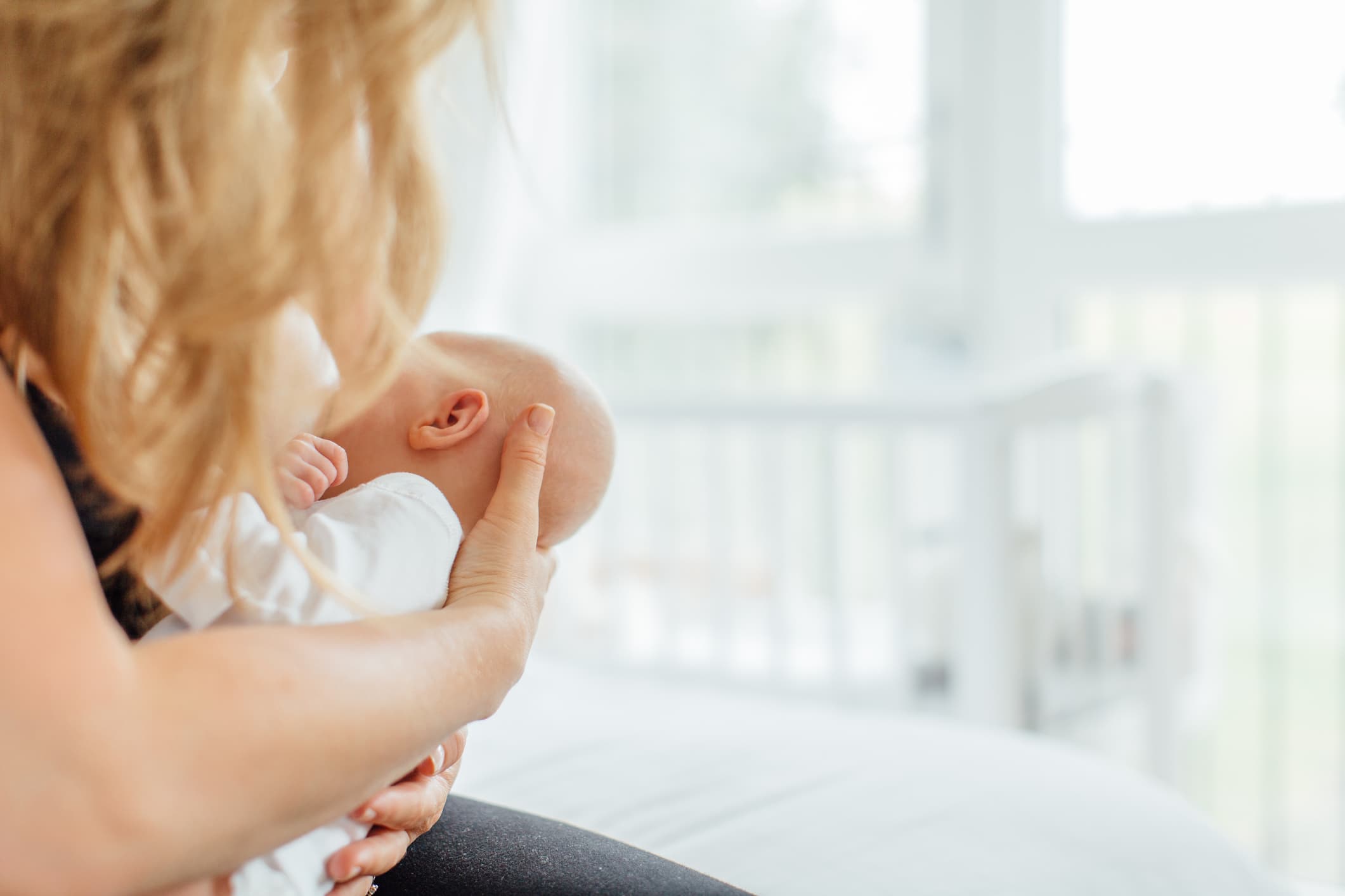 Mother breastfeeding baby