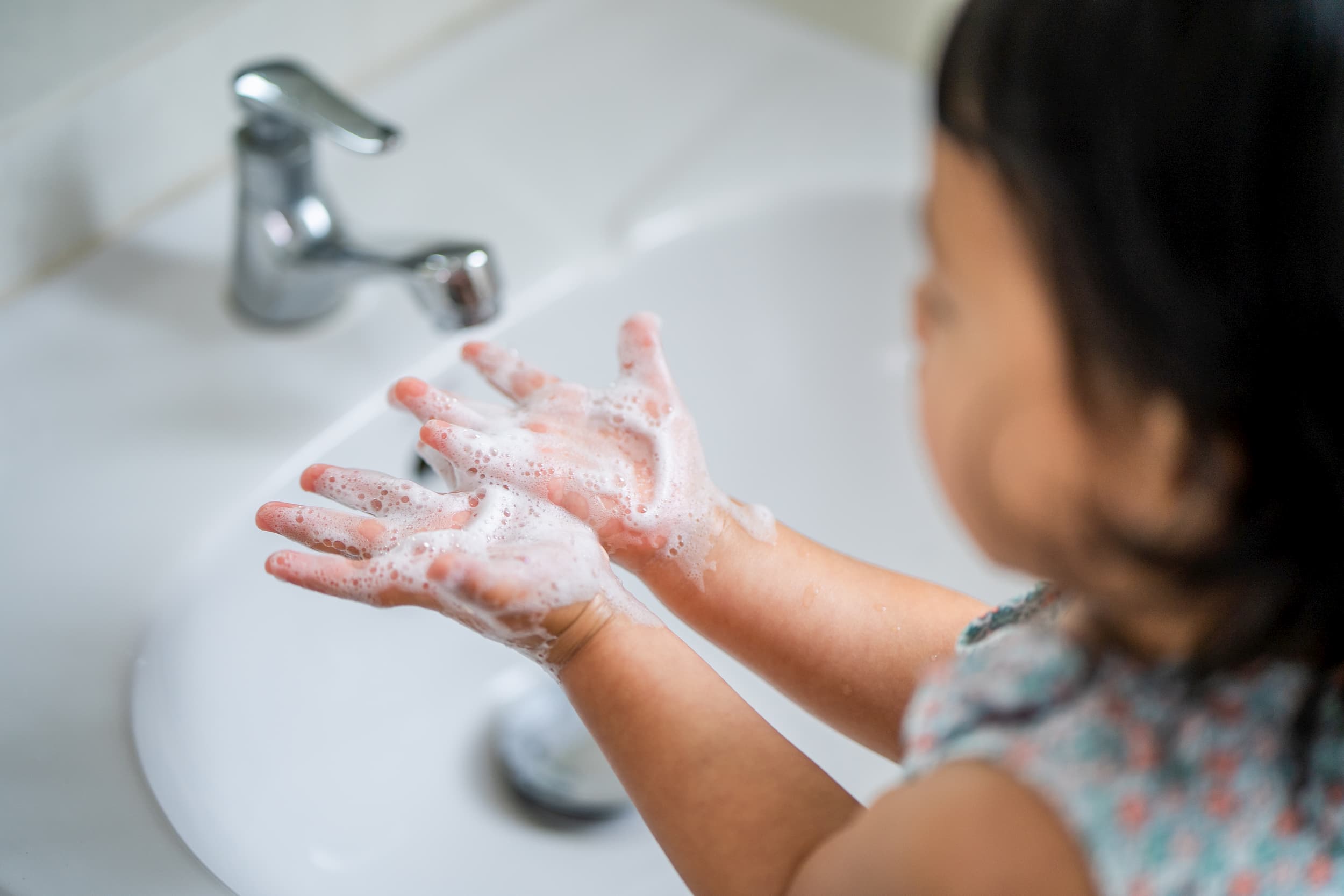 Female child washing hands
