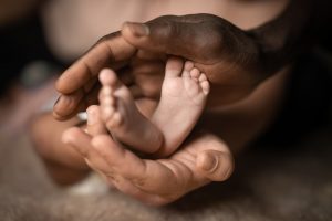 Holding baby's feet